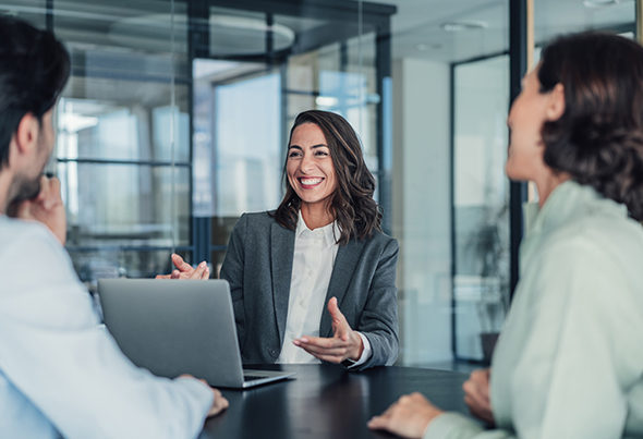 Businesswoman talking to two people
