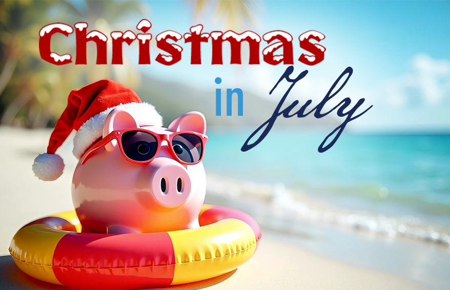 Piggy bank on a beach wearing a Santa hat and sunglasses