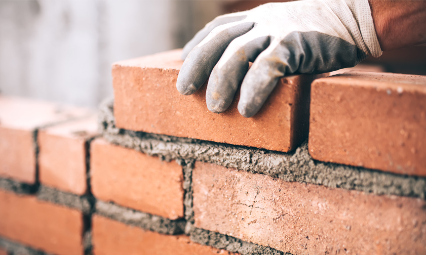 Laying brick wall